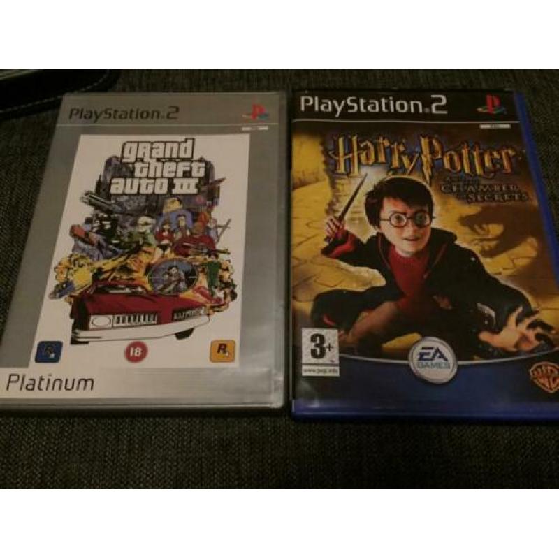 Playstation 2 met 34 spellen, koptelefoon en 2 controllers